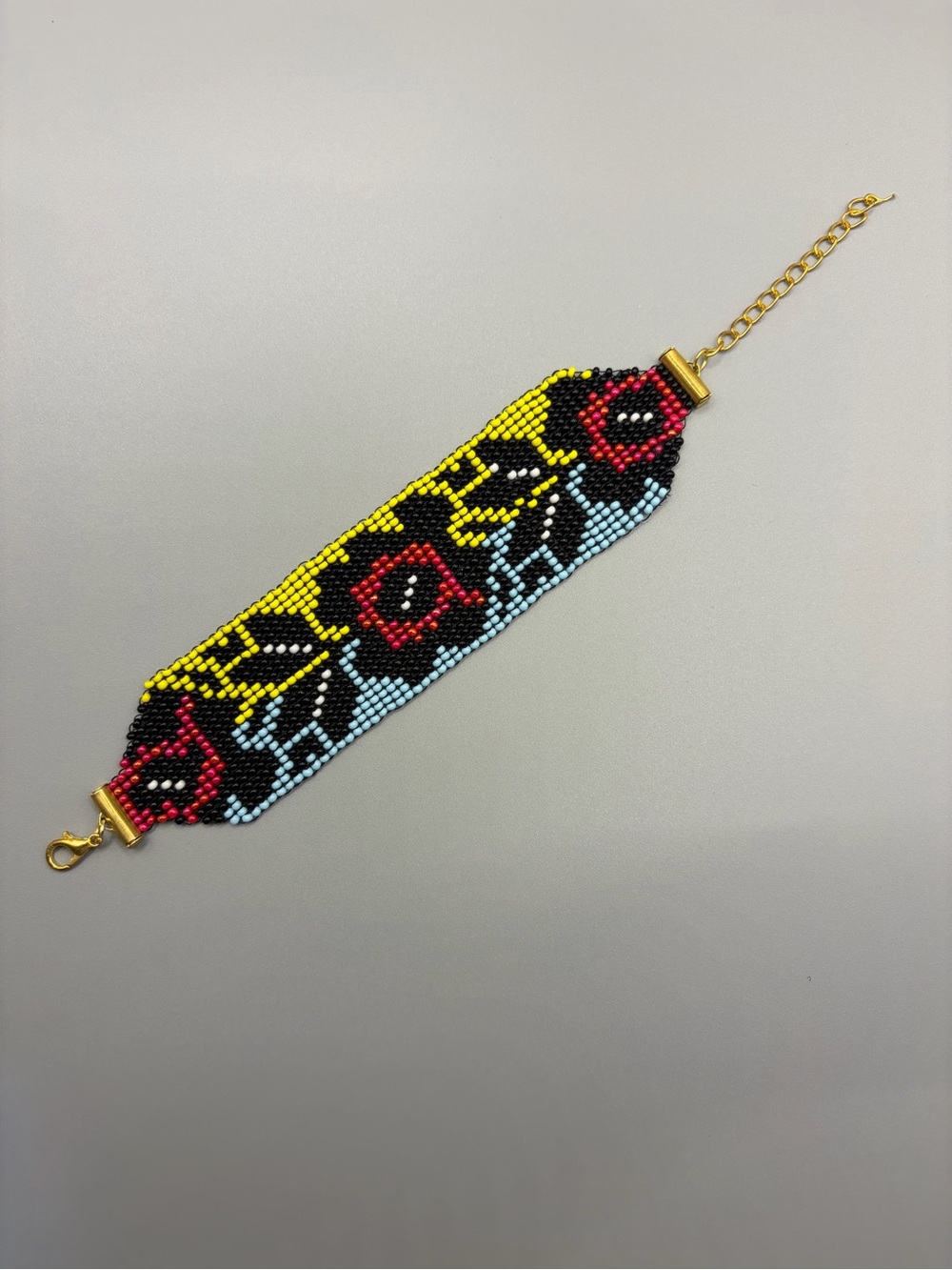 Handcrafted Beaded Floral Bracelet - Red, Yellow, Black, Light Blue